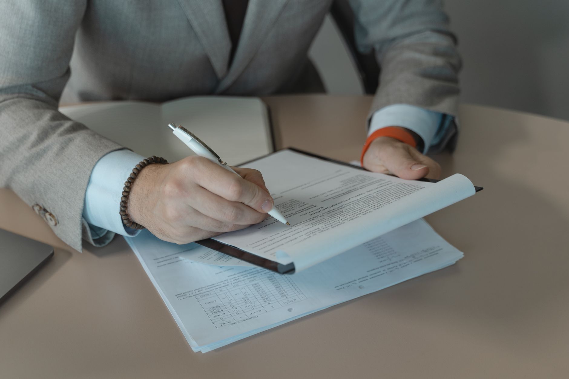 Polished businessman analyzing contract document terms