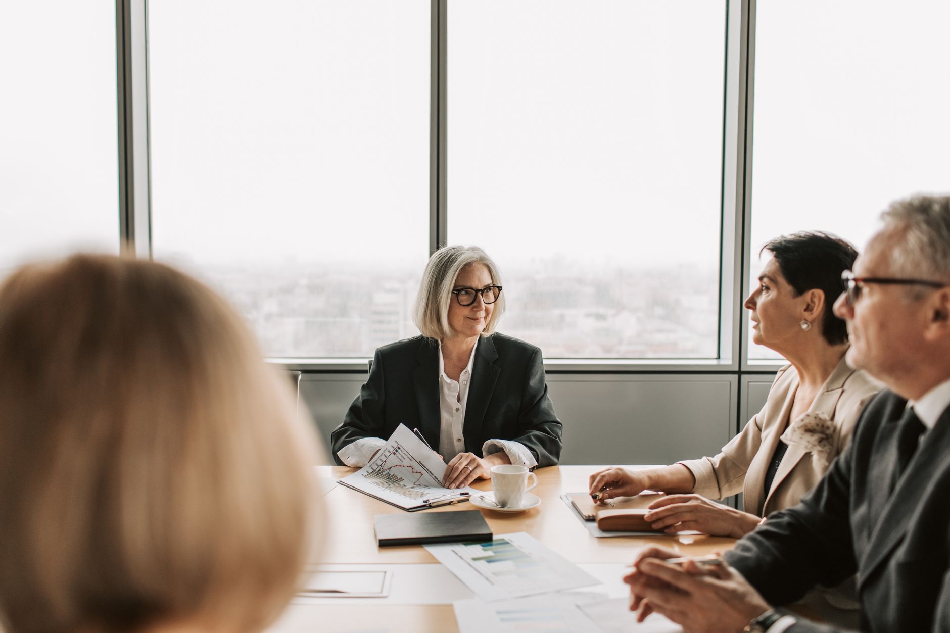 Corporate negotiations in luxurious glass business office